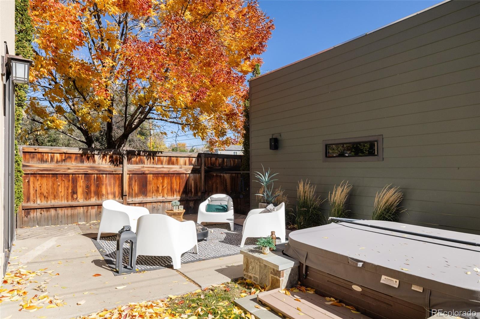 2696 Meade Street Denver, CO 80211 - Photo 40 of 46 a patio with table and chairs and potted plants