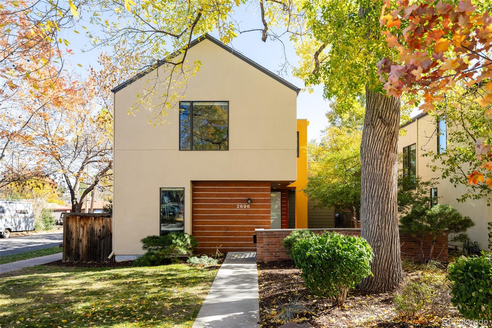 2696 Meade Street Denver, CO 80211 - Photo 44 of 46 a view of a house with a yard