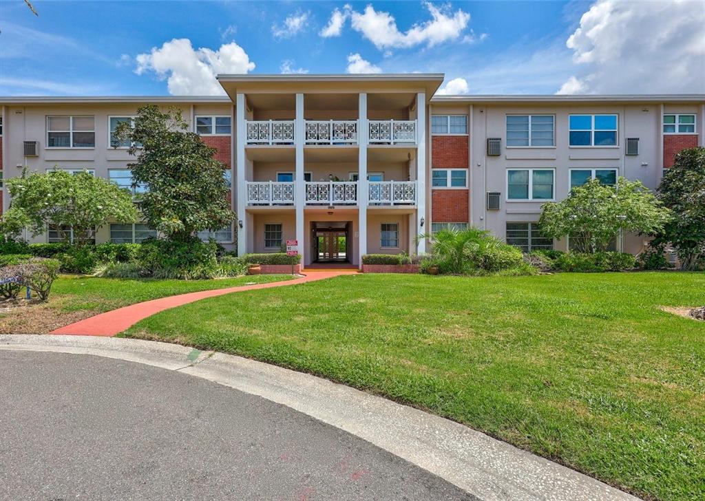 3125 36th Street North, Unit 208 St. Petersburg, FL 33713 - Photo 1 of 29 a view of a building with a yard