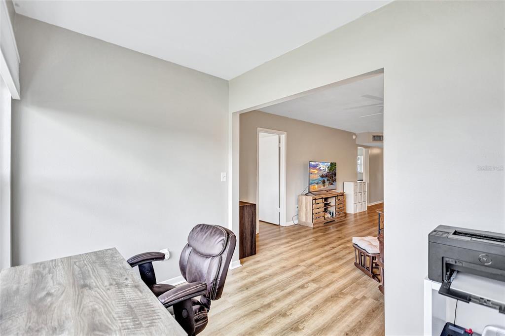 3125 36th Street North, Unit 208 St. Petersburg, FL 33713 - Photo 12 of 29 a view of a workspace with furniture and a window