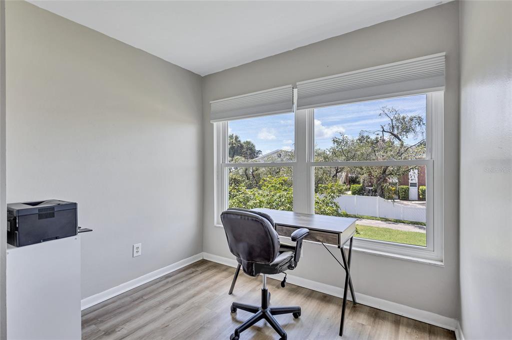3125 36th Street North, Unit 208 St. Petersburg, FL 33713 - Photo 13 of 29 a view of a workspace with furniture and a window