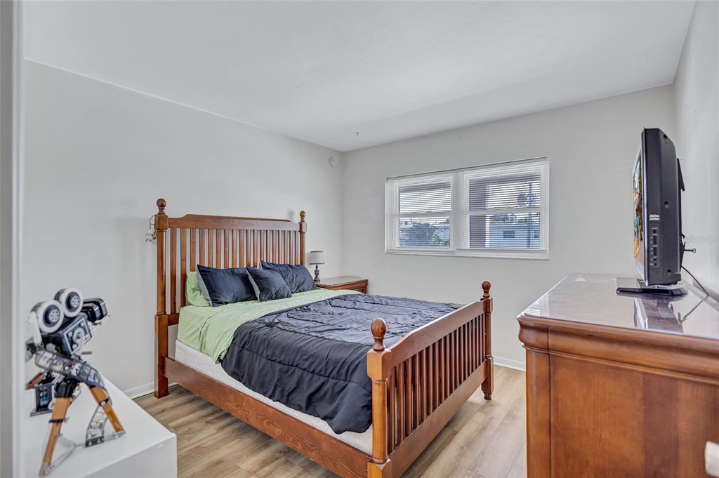 3125 36th Street North, Unit 208 St. Petersburg, FL 33713 - Photo 20 of 29 a bedroom with a bed and a dresser