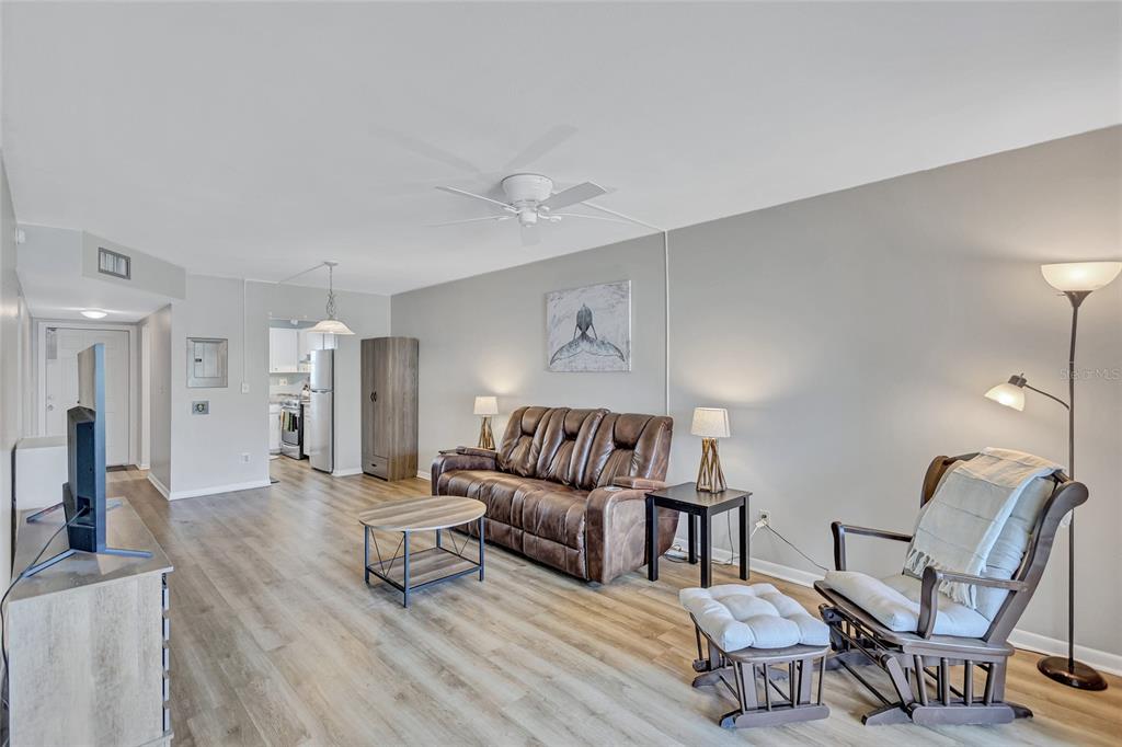 3125 36th Street North, Unit 208 St. Petersburg, FL 33713 - Photo 7 of 29 a living room with furniture and wooden floor