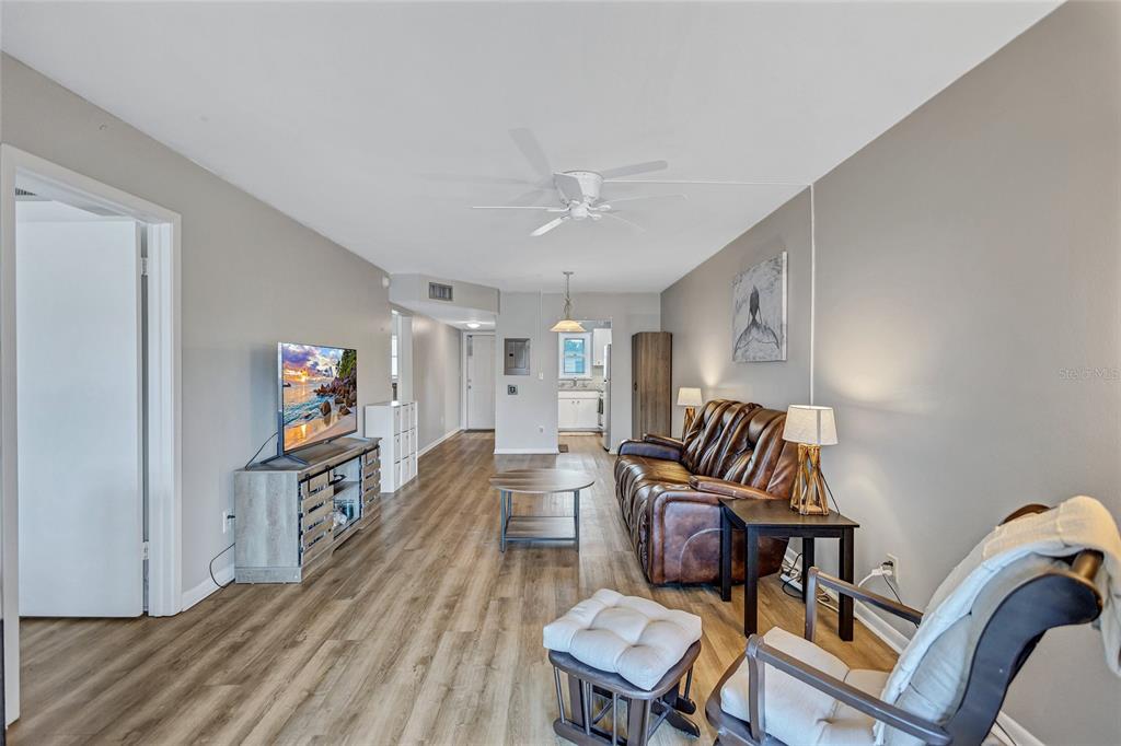 3125 36th Street North, Unit 208 St. Petersburg, FL 33713 - Photo 10 of 29 a living room with furniture and a wooden floor