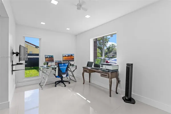 a workspace with furniture and a window