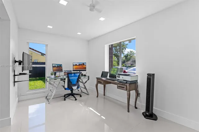 a workspace with furniture and a window