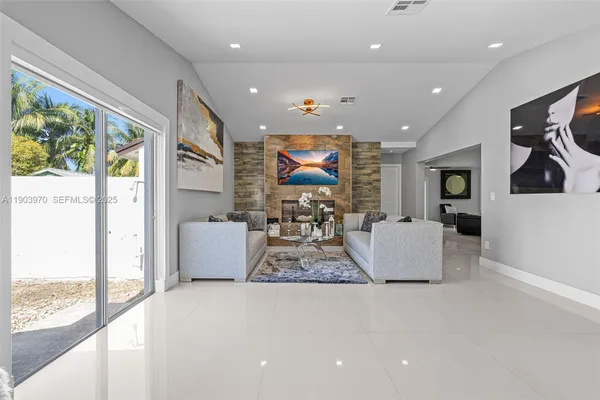 a living room with furniture and a large window