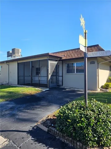 a view of a house with backyard and swimming pool