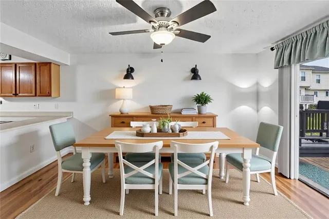 a dining room with furniture and window