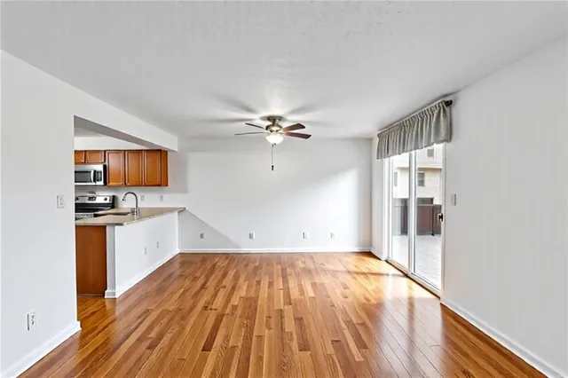 a view of a kitchen with microwave and a stove