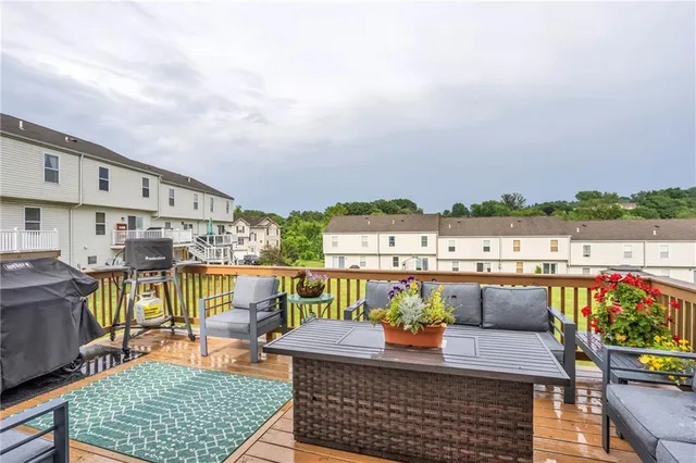 a view of roof deck with patio