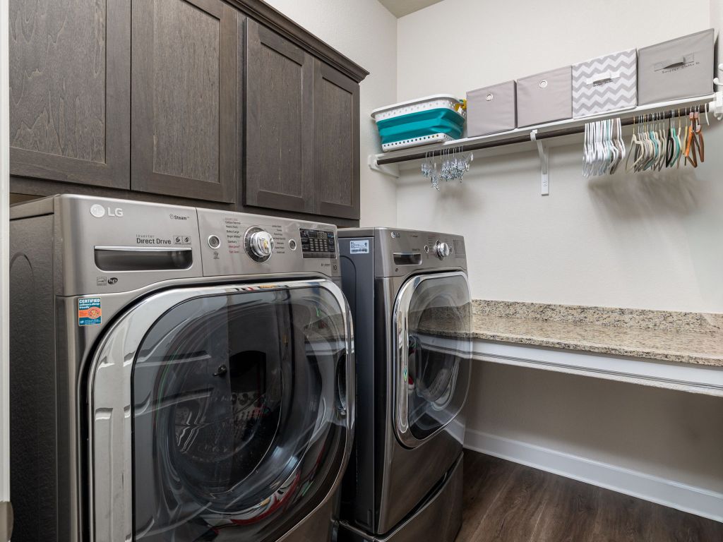 1145 West County Road East Lexington, TX 78947 - Photo 21 of 34 a utility room with dryer and washer
