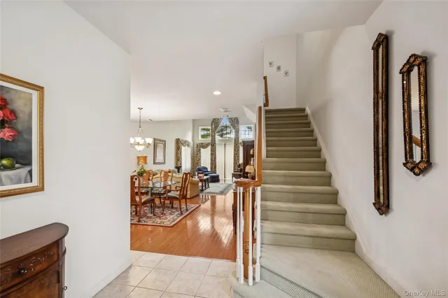 a dining room with furniture and a painting