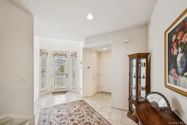 a view of an entryway with a workspace