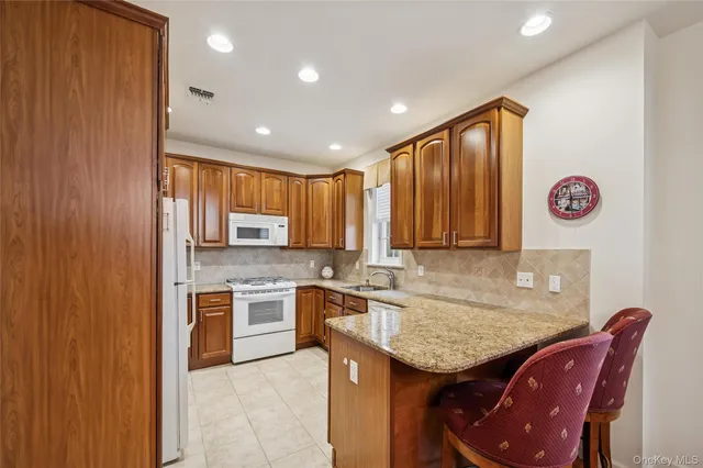 a kitchen with a sink cabinets and window