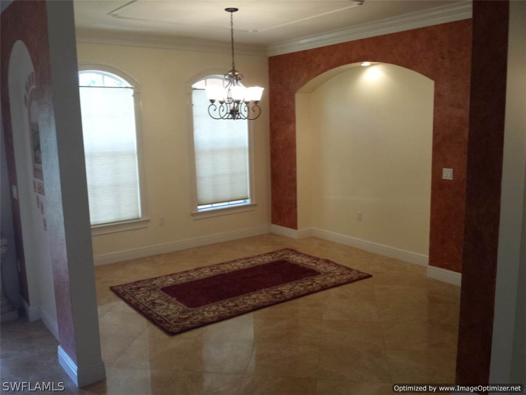8448 Grove Road Fort Myers, FL 33967 - Photo 9 of 23 a view of kitchen and chandelier