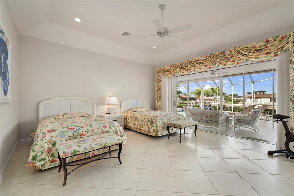 1030 Conecta Drive Punta Gorda, FL 33950 - Photo 24 of 74 a bedroom with furniture and a large window