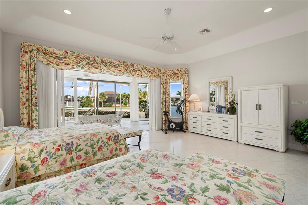 1030 Conecta Drive Punta Gorda, FL 33950 - Photo 25 of 74 a bedroom with furniture and large windows