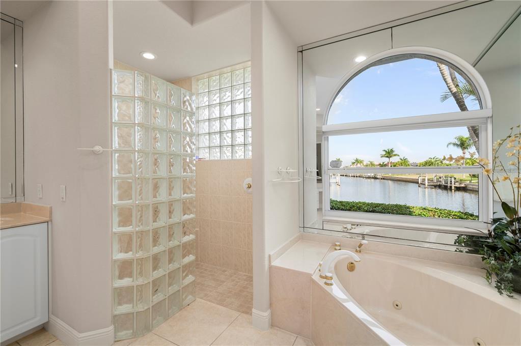 1030 Conecta Drive Punta Gorda, FL 33950 - Photo 29 of 74 a bathroom with a bathtub and a shower
