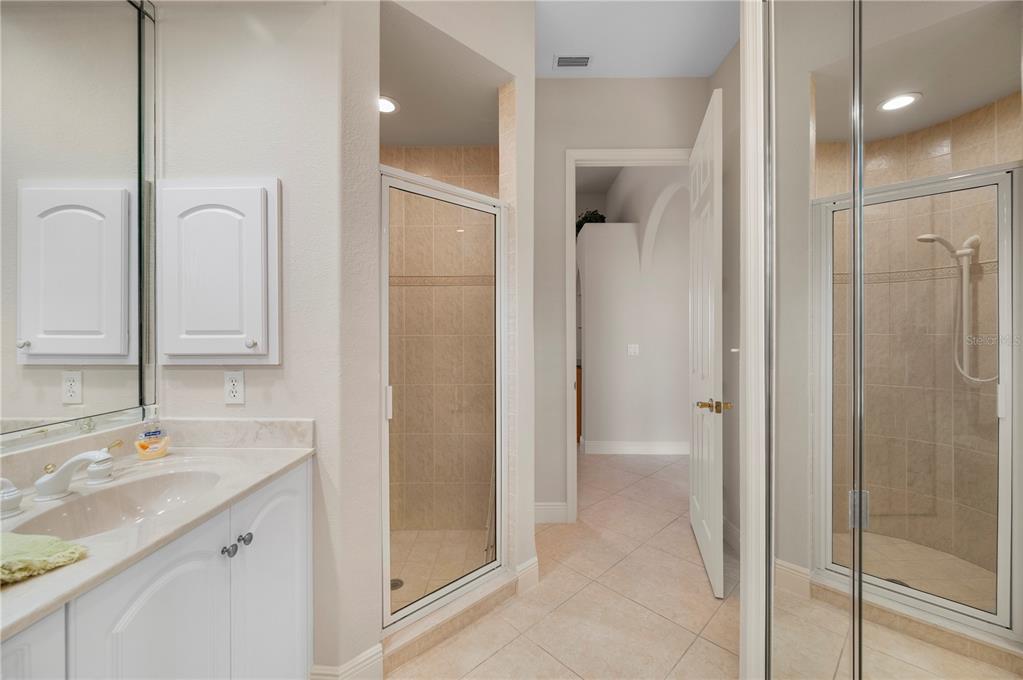 1030 Conecta Drive Punta Gorda, FL 33950 - Photo 33 of 74 a bathroom with a granite countertop shower sink and mirror