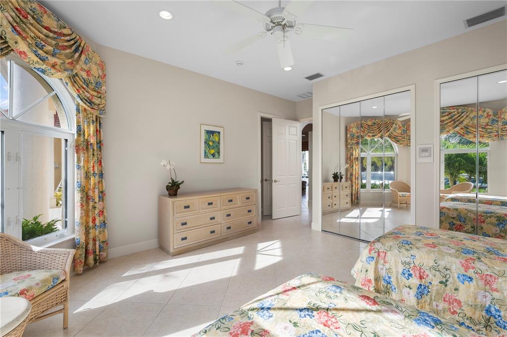 1030 Conecta Drive Punta Gorda, FL 33950 - Photo 36 of 74 a bedroom with a bed and large windows