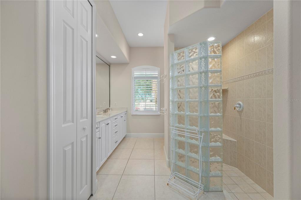 1030 Conecta Drive Punta Gorda, FL 33950 - Photo 41 of 74 a bathroom with a glass shower door and a sink