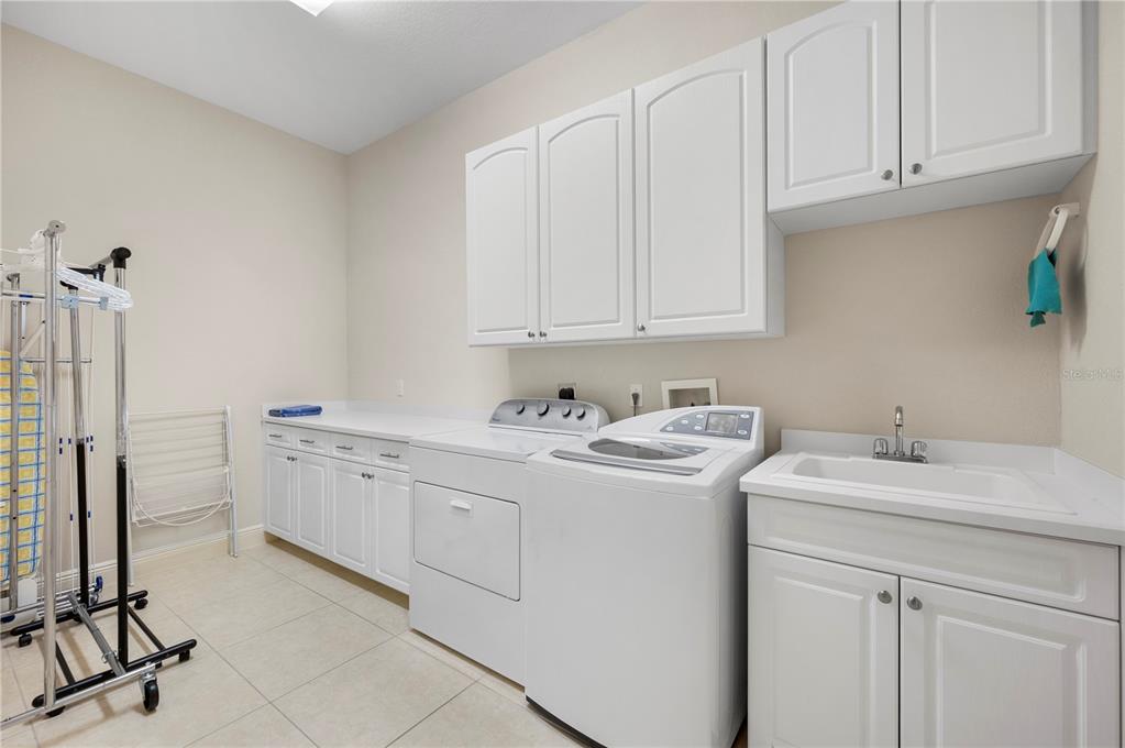 1030 Conecta Drive Punta Gorda, FL 33950 - Photo 51 of 74 a view of a sink and dishwasher with white cabinets