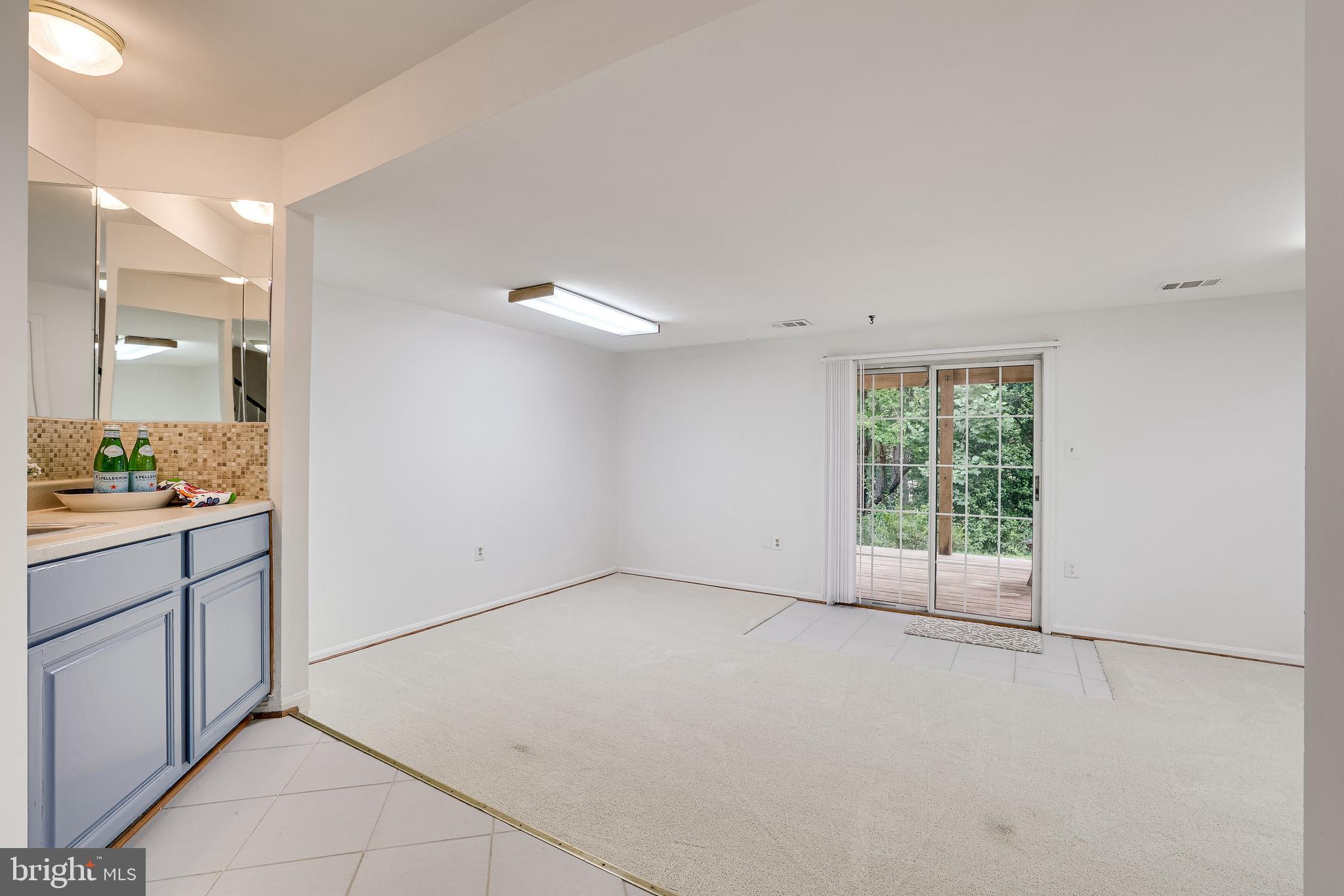 11962 Sentinel Point Court Reston, VA 20191 - Photo 46 of 62 The lower level opens to the recreation room.