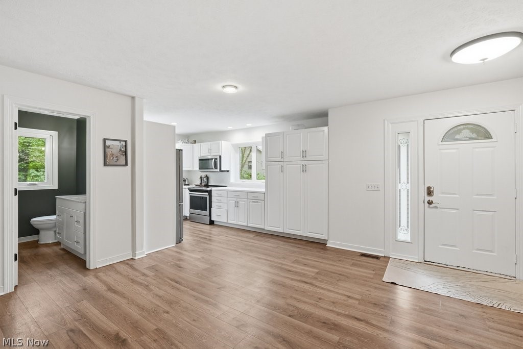 2323 Call Road Stow, OH 44224 - Photo 6 of 42 Open-concept main living area featuring wide plank wood-finish flooring