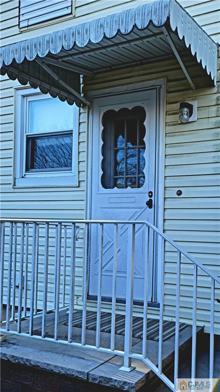 24 Latonia Street Edison, NJ 08817 - Photo 2 of 7 a front view of a house with a door