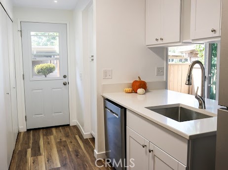 2321 Fuschia Lane Tustin, CA 92780 - Photo 2 of 5 a kitchen with a sink and cabinets