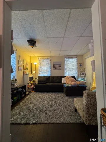 a living room with a couch and a table