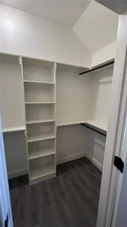 a view of an empty walk in closet