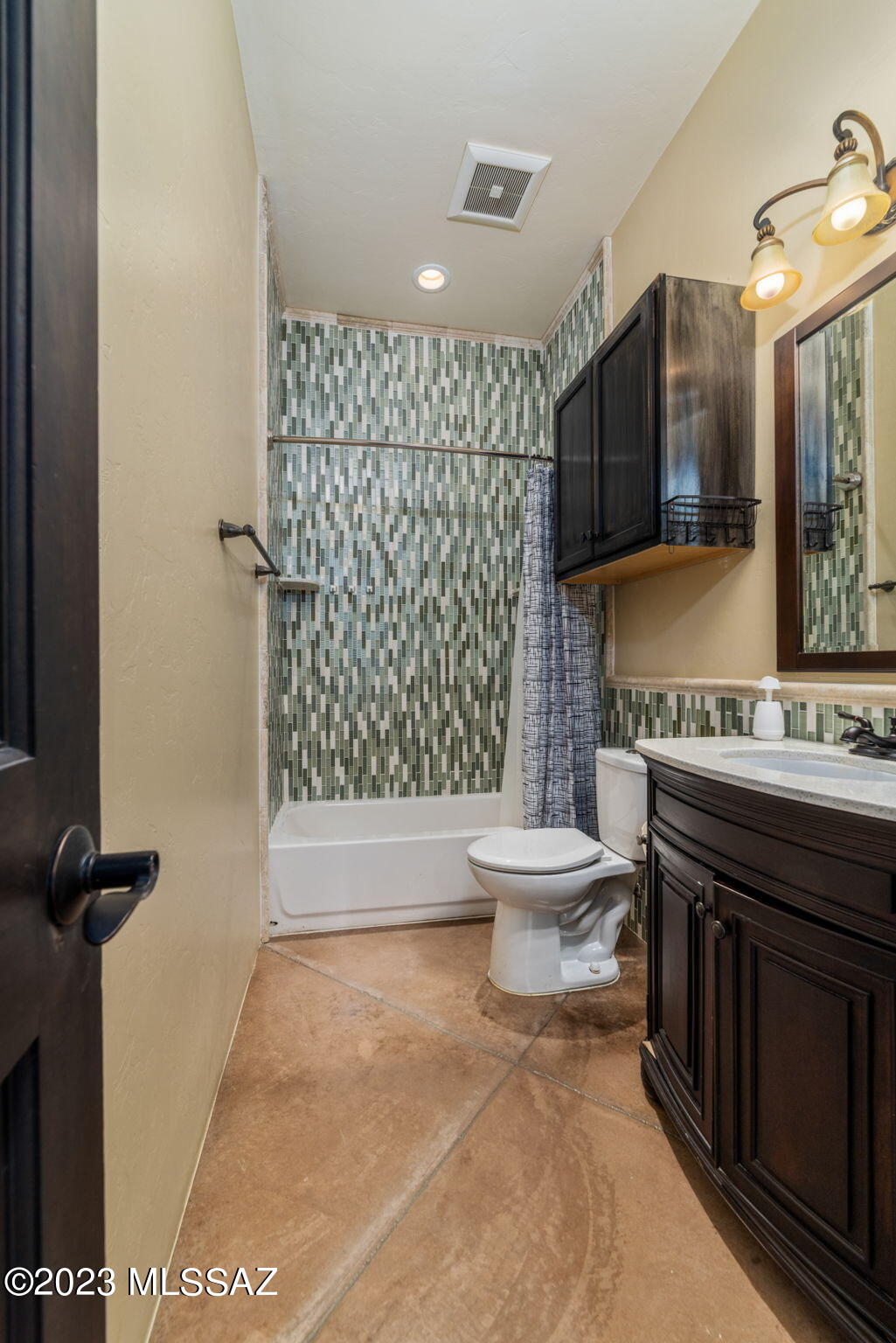 5670 Triangle X Place Tucson, AZ 85713 - Photo 16 of 36 a bathroom with a granite countertop sink toilet and shower