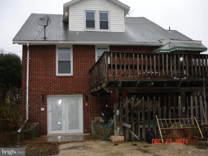 4511 Powder Mill Road Beltsville, MD 20705 - Photo 1 of 13 a view of a house with wooden deck