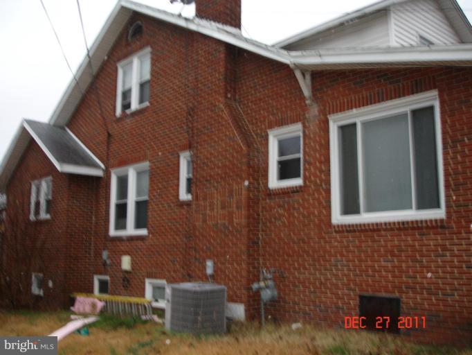 4511 Powder Mill Road Beltsville, MD 20705 - Photo 2 of 13 a front view of a house with garden