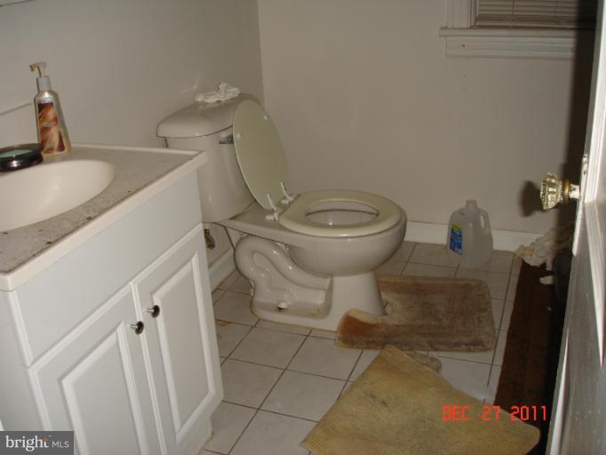 4511 Powder Mill Road Beltsville, MD 20705 - Photo 4 of 13 a bathroom with a sink and a toilet