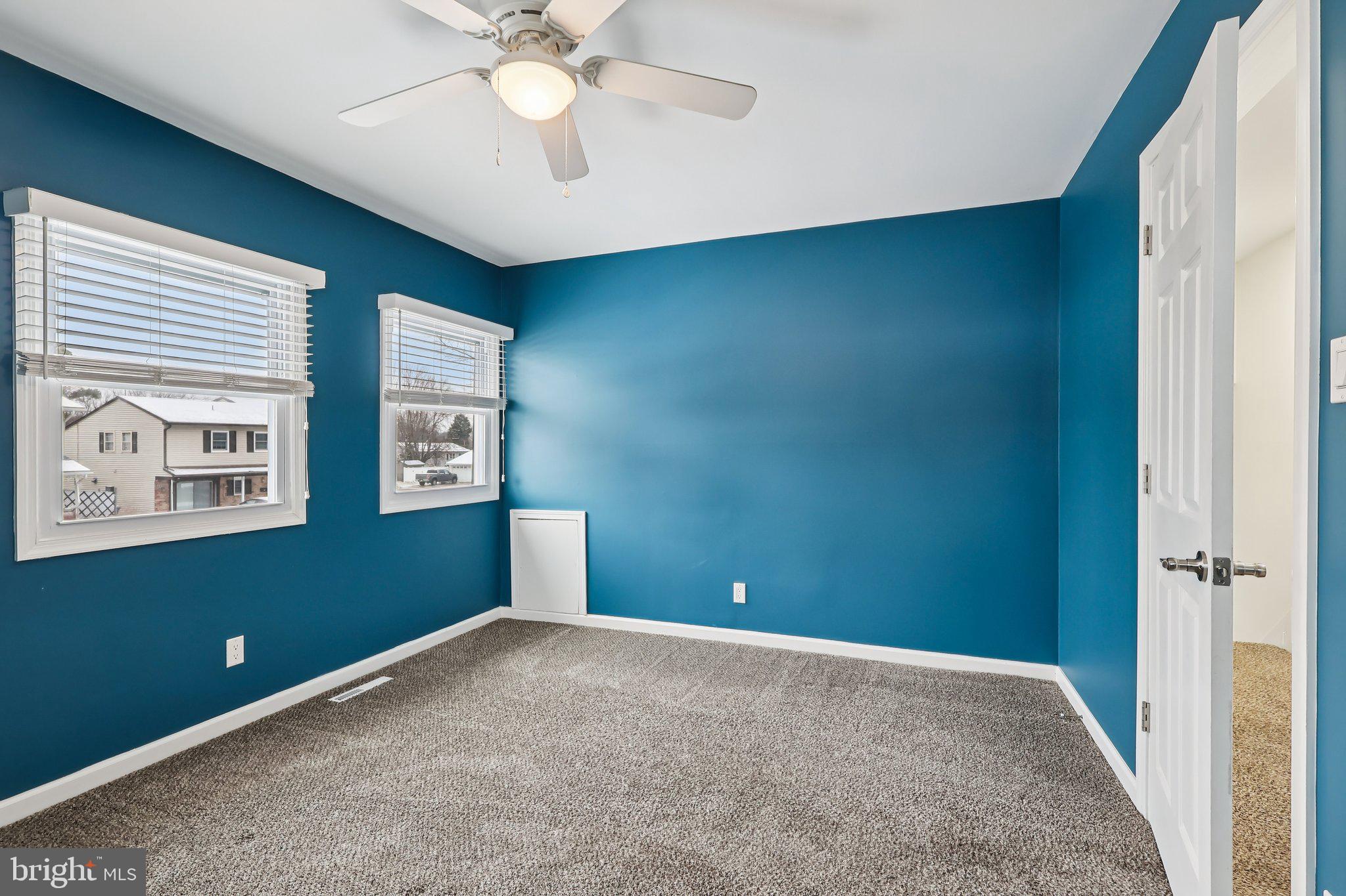 103 Anglin Drive Newark, DE 19713 - Photo 17 of 25 an empty room with windows and fan
