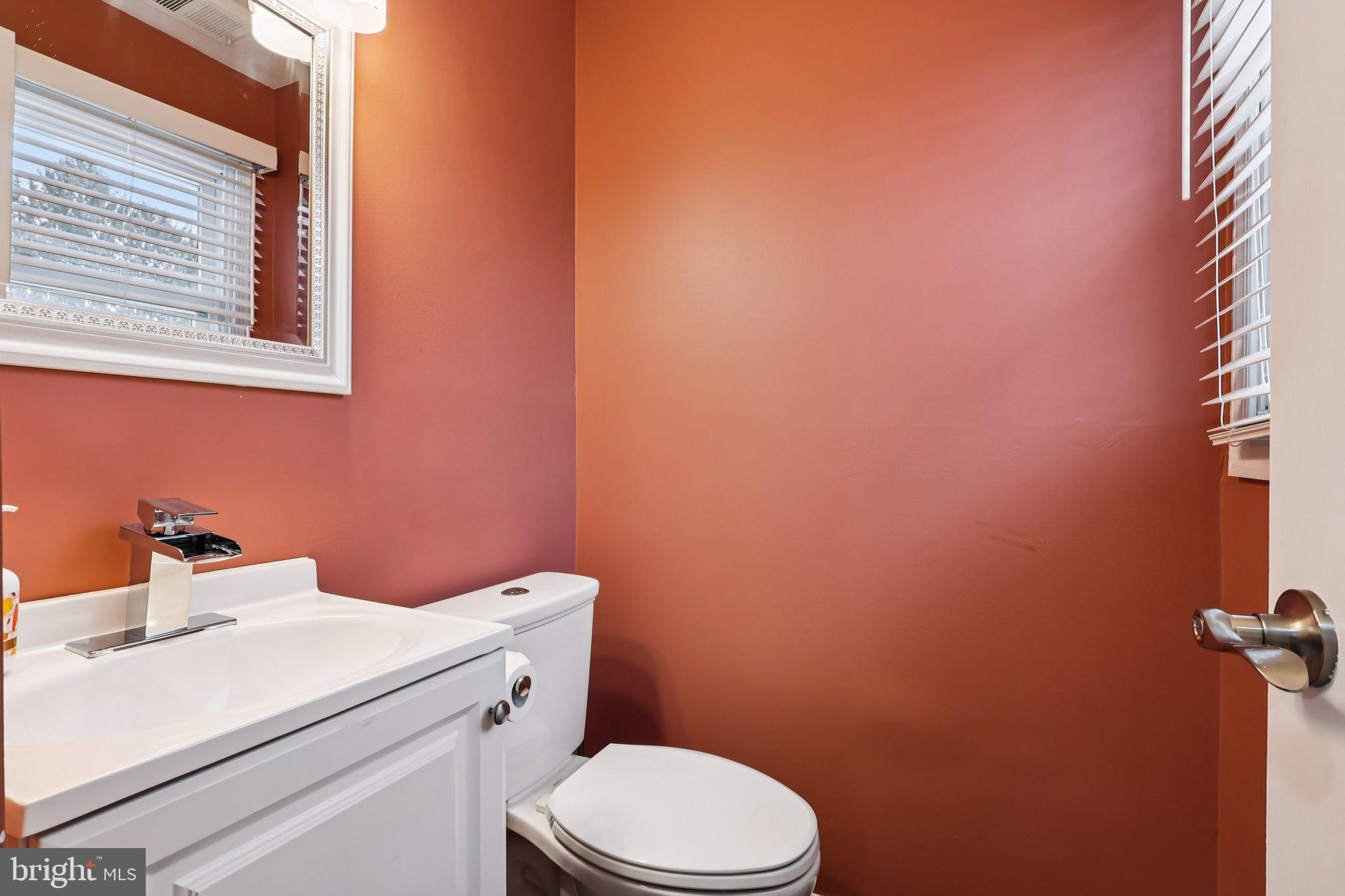 103 Anglin Drive Newark, DE 19713 - Photo 8 of 25 a bathroom with a sink a toilet and a window