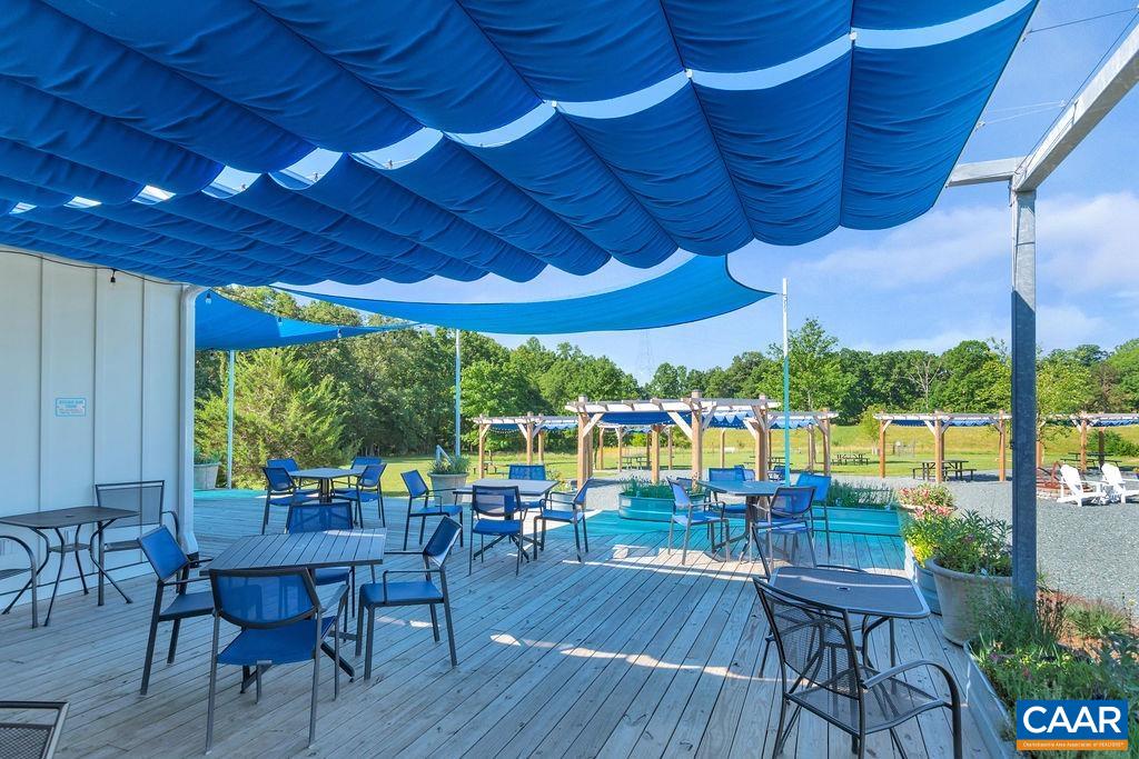 3304 A Ruritan Lake Road Palmyra, VA 22963 - Photo 35 of 37 a patio with wooden floor and outdoor seating