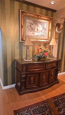 a kitchen with granite countertop a sink and cabinets