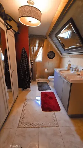 a room with gym equipment and a rug