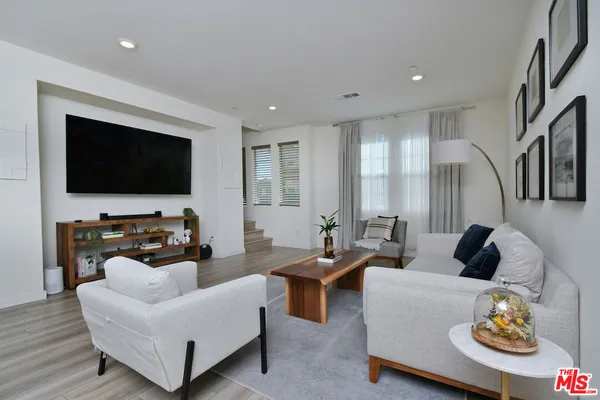 a dining room with kitchen island a table and chairs