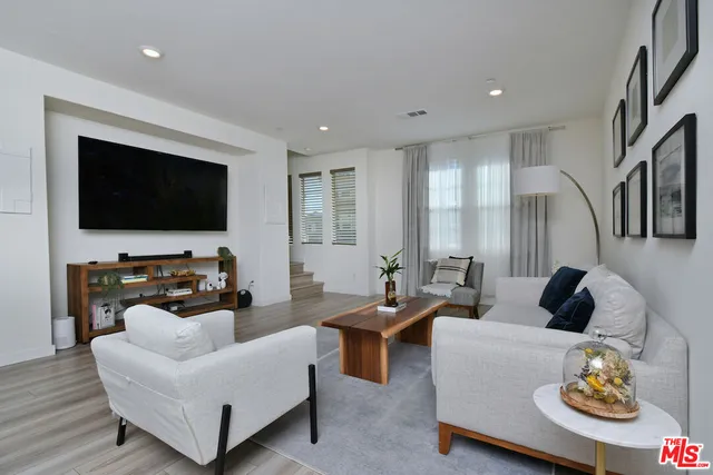 a dining room with kitchen island a table and chairs