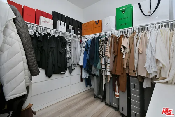 a bedroom with a bed and a table