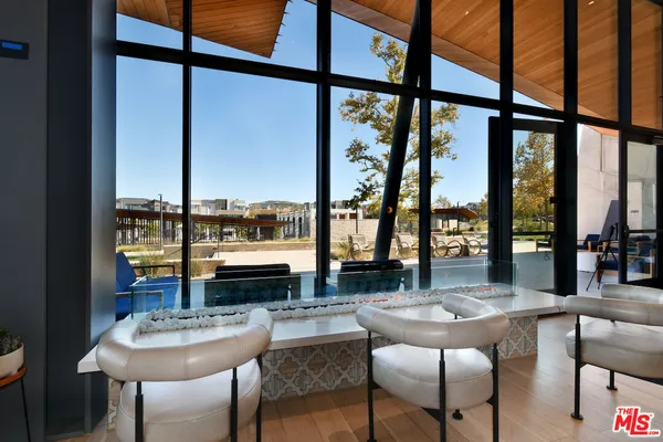 a view of balcony with furniture