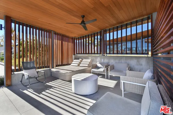 a view of a swimming pool with a patio