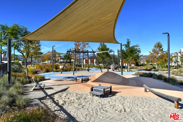 a view of a swimming pool with outdoor seating