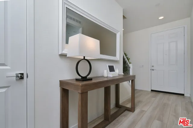 a bedroom with a bed and a table