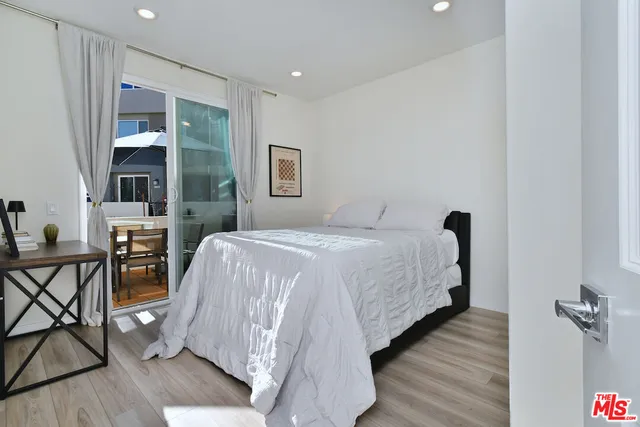 a bathroom with a toilet sink and a mirror